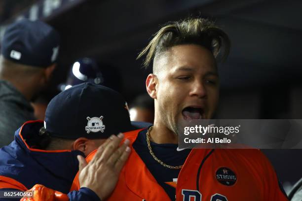Yuli Gurriel of the Houston Astros celebrates after hitting a 3-run double during the sixth inning against the New York Yankees in Game Four of the...