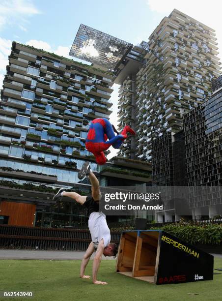 Parkour athletes dressed as spiderman practice manouvres at Central Park on October 18, 2017 in Sydney, Australia.