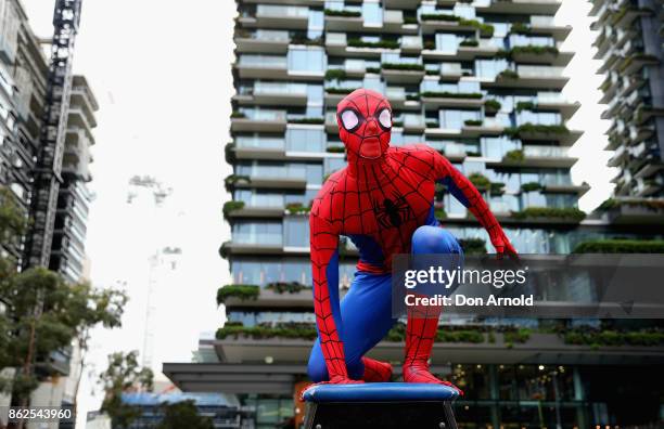 Parkour athletes dressed as spiderman pose at Central Park on October 18, 2017 in Sydney, Australia.