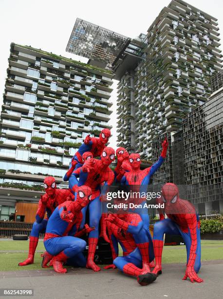 Parkour athletes dressed as spiderman pose at Central Park on October 18, 2017 in Sydney, Australia.