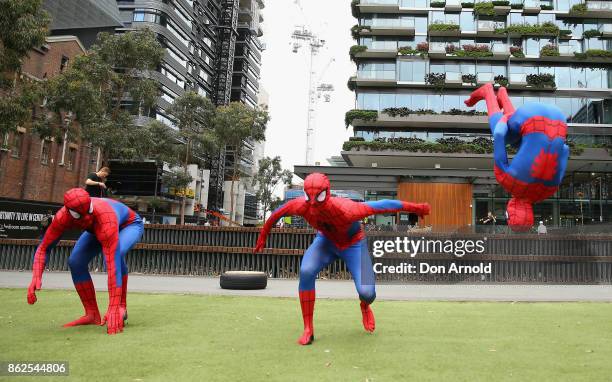 Parkour athletes dressed as spiderman practice manouvres at Central Park on October 18, 2017 in Sydney, Australia.