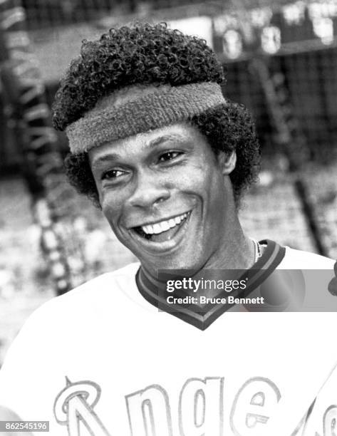 Rod Carew of the California Angels smiles and wears a head band during batting practice before an MLB game against the New York Yankees on July 23,...