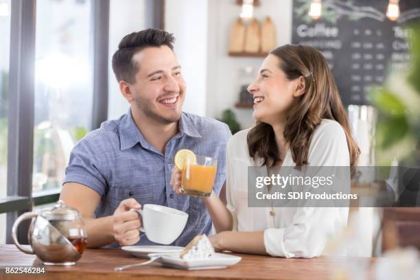 young woman and young man on a first date - blind date stock pictures, royalty-free photos & images