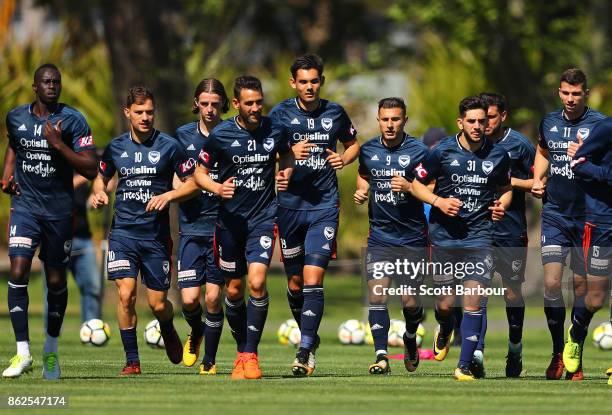 Thomas Deng, James Troisi, Carl Valeri, Pierce Waring, Kosta Barbarouses, Christian Theoharous and Mitch Austin of the Victory run during a Melbourne...