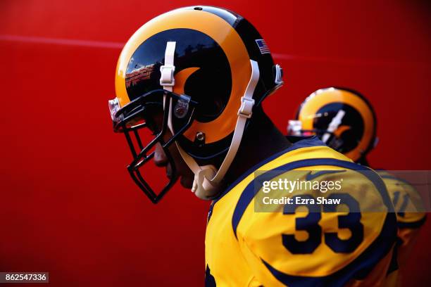 Justin Davis of the Los Angeles Rams and Tavon Austin of the Los Angeles Rams walk out of the tunnel to warm up before their game against the San...