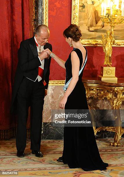 King Juan Carlos of Spain receives Carla Bruni Sarkozy at the Gala Dinner honouring French President Nicolas Sarkozy, at The Royal Palace, on April...