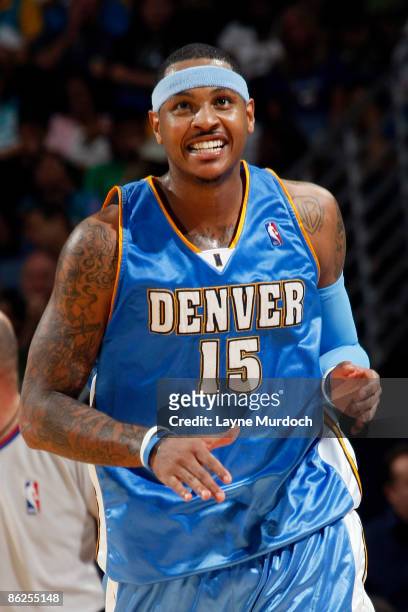Carmelo Anthony of the Denver Nuggets smiles after sinking a three-pointer against the New Orleans Hornets in Game Four of the Western Conference...