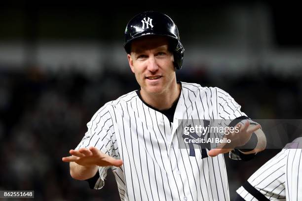 Todd Frazier of the New York Yankees reacts on third base after a double by Chase Headley during the eighth inning against the Houston Astros in Game...