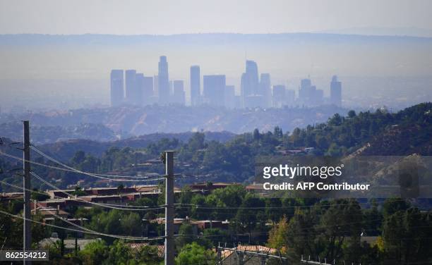 Layer of pollution can be seen hovering over Los Angeles, California on October 17 where even though air quality has improved in recent decades, smog...