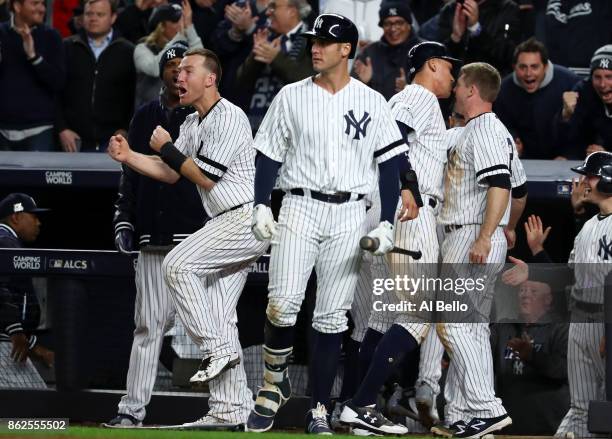 Todd Frazier of the New York Yankees celebrates after a go ahead run during the eighth inning against the Houston Astros in Game Four of the American...