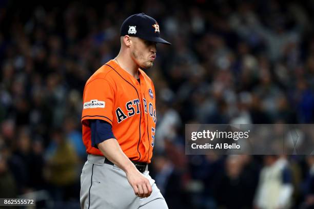 Ken Giles of the Houston Astros walks off the mound as he leaves the game during the eighth inning against the New York Yankees in Game Four of the...