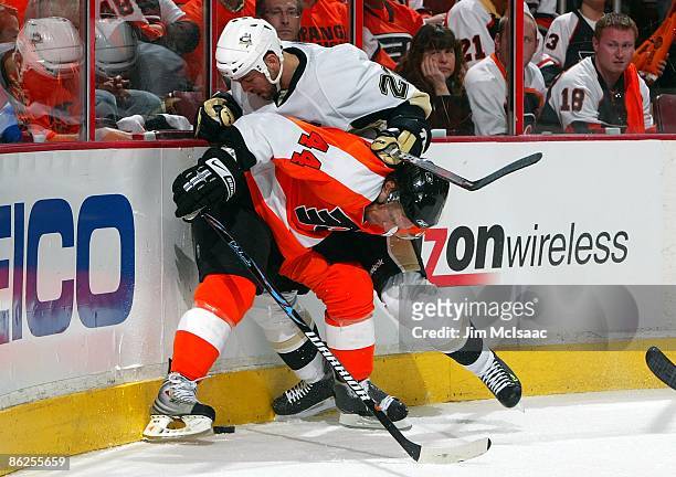Kimmo Timonen of the Philadelphia Flyers skates against Craig Adams of the Pittsburgh Penguins during Game Six of the Eastern Conference Quarterfinal...