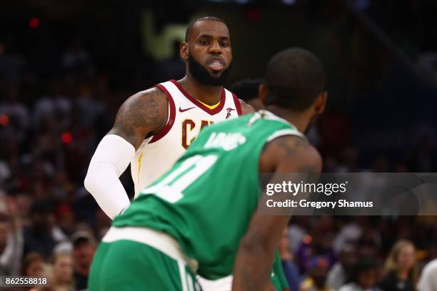 LeBron James of the Cleveland Cavaliers goes to greet Kyrie Irving of the Boston Celtics prior to playing at at Quicken Loans Arena on October 17,...