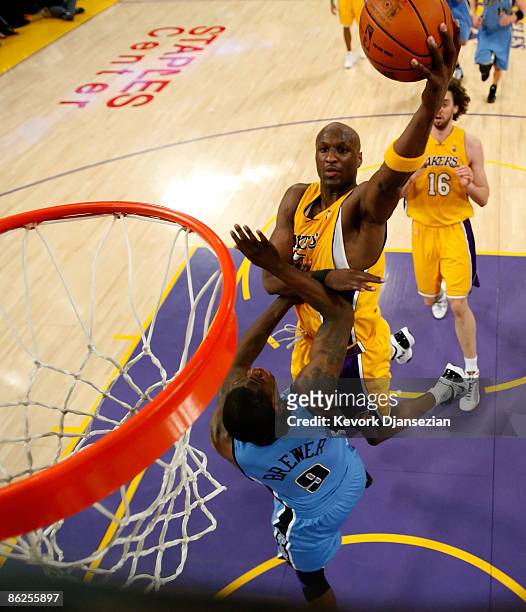Lamar Odom of the Los Angeles Lakers goes up for a shot over Ronnie Brewer of the Utah Jazz in the first half of Game Five of the Western Conference...