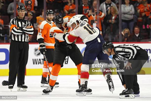 Wayne Simmonds of the Philadelphia Flyers and Micheal Haley of the Florida Panthers fight during the second period at Wells Fargo Center on October...