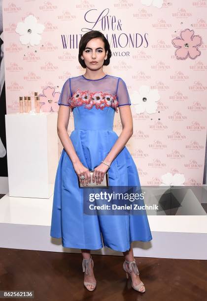 Camilla Belle poses during the launch of Love & White Diamonds Fragrance at Academy Mansion on October 17, 2017 in New York City.