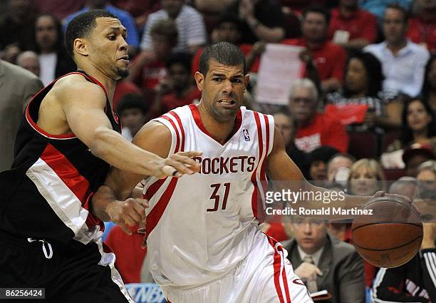 Forward Shane Battier of the Houston Rockets dribbles the ball past Brandon Roy of the Portland Trail Blazers in Game Four of the Western Conference...