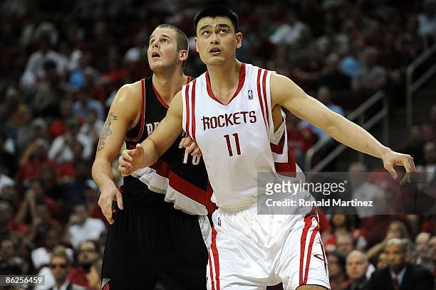 Center Joel Przybilla of the Portland Trail Blazers and Yao Ming of the Houston Rockets in Game Four of the Western Conference Quarterfinals during...