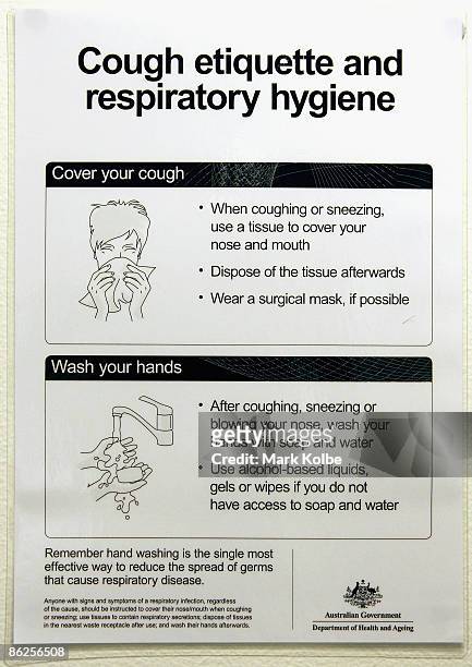Cough etiquette and respiratory hygiene sign is seen at the Sydney International airport on April 28, 2009 in Sydney, Australia. Swine Influenza...