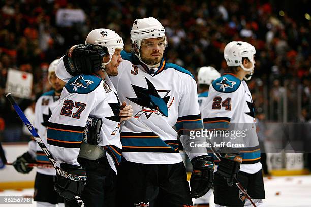 Jeremy Roenick and Douglas Murray of the San Jose Sharks console each other after being eliminated from the playoffs by the Anaheim Ducks during Game...