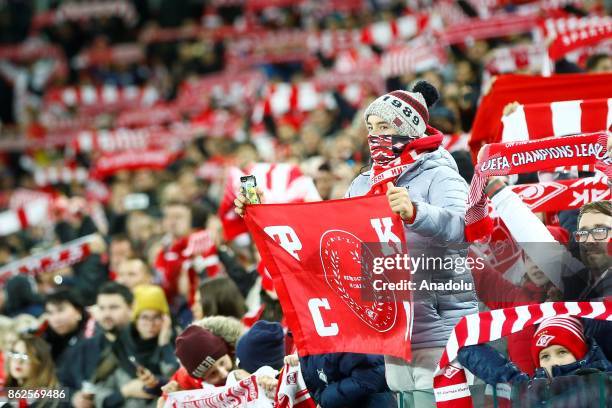 Fans of Spartak Moscow support their team during the UEFA Champions League match between Spartak Moscow and Sevilla FC at Spartak Stadium in Moscow,...