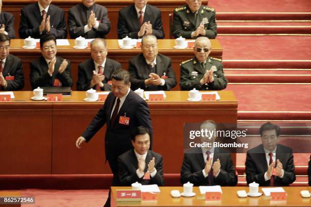 Xi Jinping, China's president, stands to speak at the opening of the 19th National Congress of the Communist Party of China at the Great Hall of the...