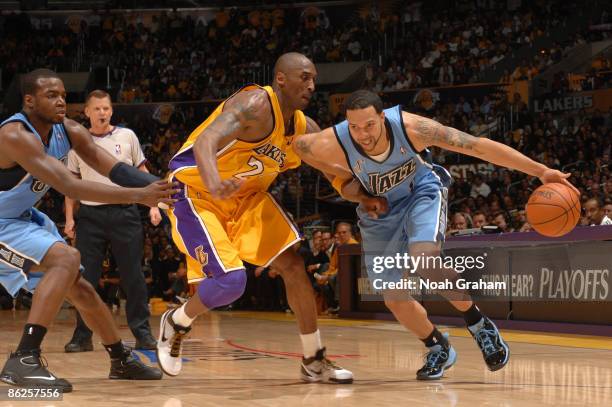 Deron Williams of the Utah Jazz drives against Kobe Bryant of the Los Angeles Lakers in Game Five of the Western Conference Quarterfinals during the...