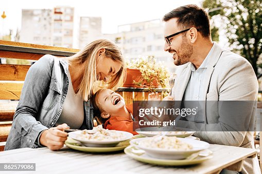 Family enjoying restaurant Family enjoying restaurant