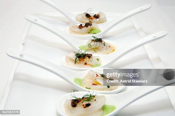 Scallop crudo is served during the Marc Forgione and Jorge Espinoza dinner presented by Ferguson Bath, Kitchen & Lighting Gallery at Scarpetta on...