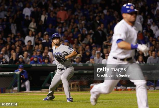 Yu Darvish of the Los Angeles Dodgers fields a bunt hit by Willson Contreras of the Chicago Cubs in the fourth inning during game three of the...