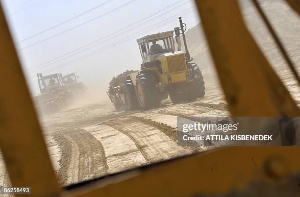 Hungarian Pannon Road-Making Ltd. Engines prepare on April 28, 2009 the ground for the new 12 kms M31 highway between the town of Godollo and the...