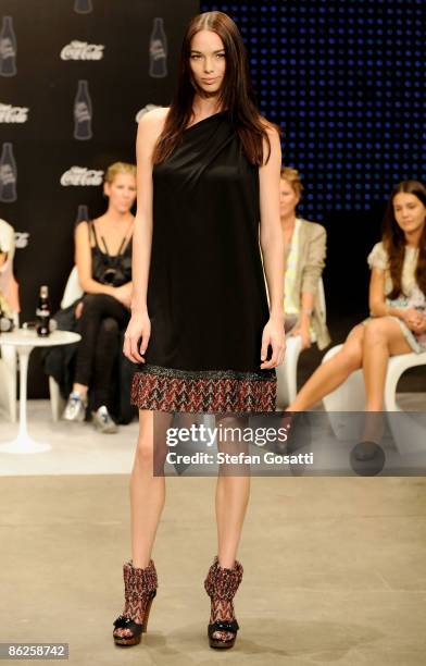 Model appears on stage ahead of the Diet Coca-Cola Little Black Dress show this evening at the Overseas Passenger Terminal, Circular Quay on day two...