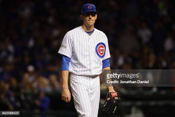 Kyle Hendricks of the Chicago Cubs walks off the field after being relieved in the sixth inning against the Los Angeles Dodgers during game three of...