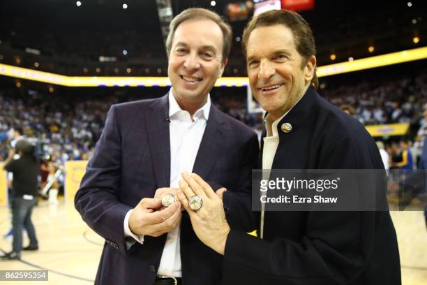 Championship rings are seen on the hands of team owners Joe Lacob and Peter Guber during their NBA game at ORACLE Arena on October 17, 2017 in...