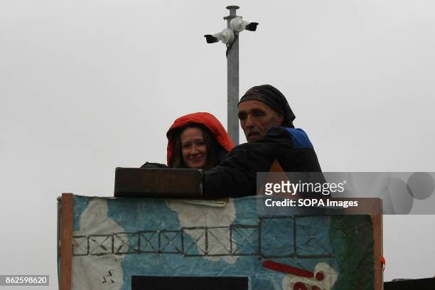 Female Anti Frack Protestor shows the photographer the steel box within which her and her partner have locked themselves on to a wooden tower to...