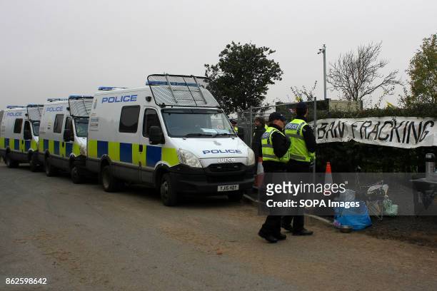 Heavy handed police presence cordons a Fracking Companies main gate to prevent Anti- Fracking Protestors from assisting two friends who have locked...