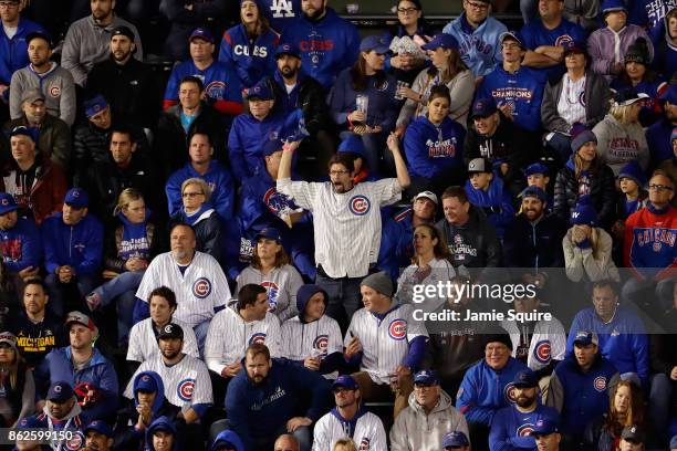 Fan cheers during game three of the National League Championship Series between the Los Angeles Dodgers and the Chicago Cubs at Wrigley Field on...