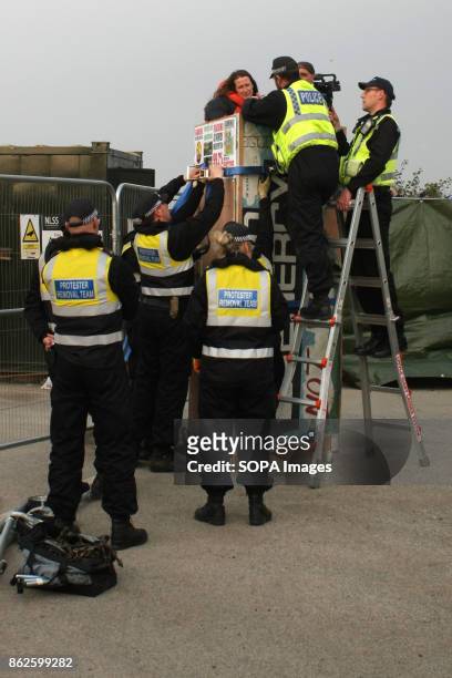 Assisted by a "Protestor Removal Team" heavy handed police with cutting tools, move in to attempt to remove two Anti-Fracking protestors who have...