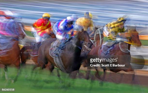 horse race. jockeys riding horses, blurred motion  - 騎手 ストックフォトと画像