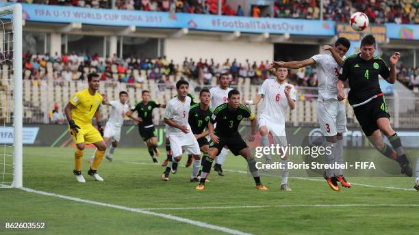 Luis Olivas of Mexico jumps for a header with Ahmad Jalali of Iran during the FIFA U-17 World Cup India 2017 Round of 16 match between Iran and...