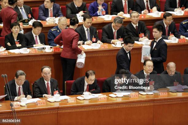 Yu Zhengsheng, chairman of the Chinese People's Political Consultative Conference , front row from left, Wang Qishan, secretary of the Central...