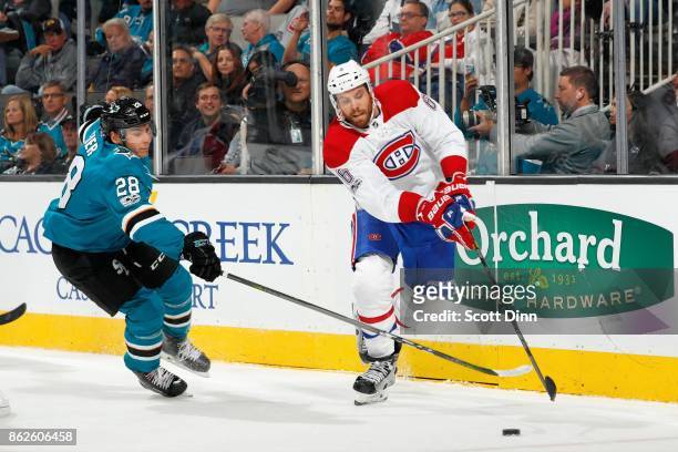Timo Meier of the San Jose Sharks and Shea Weber of the Montreal Canadiens race for the puck at SAP Center on October 17, 2017 in San Jose,...