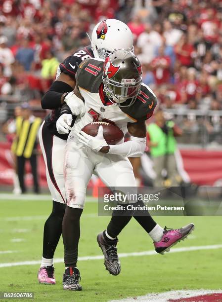 Wide receiver DeSean Jackson of the Tampa Bay Buccaneers catches a touchdown pass against cornerback Justin Bethel of the Arizona Cardinals during...