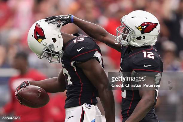 Wide receiver Jaron Brown of the Arizona Cardinals is congratulated byJohn Brown during the first half of the NFL game against the Tampa Bay...