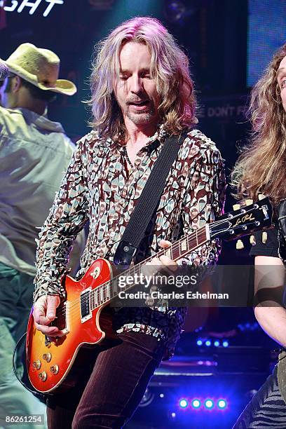 Guitarist Tommy Shaw performs during the "Rock of Ages" curtain call at the Brooks Atkinson Theatre on April 27, 2009 in New York City.