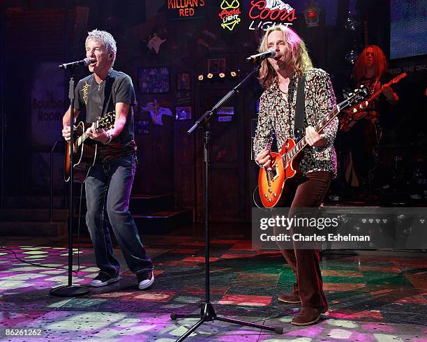 Musicians Kevin Cronin and Tommy Shaw perform during the "Rock of Ages" curtain call at the Brooks Atkinson Theatre on April 27, 2009 in New York...