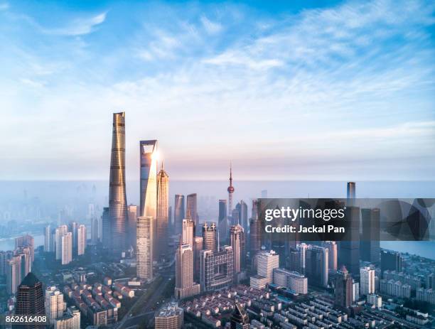 shanghai financial district in fog - chinese fotografías e imágenes de stock