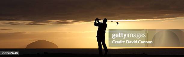 Golfers on the Ailsa Course as the sun sets behind the island of Ailsa Craig at the Westin Turnberry Resort, on October 8, 2008 in Turnberry,...