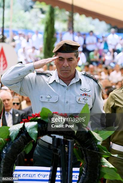 Lieutenant General Gabi Ashkenazi, Chief of the General Staff of the Israeli Defence Forces, salutes after laying a wreath during Memorial Day at...