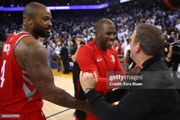 Tucker, Chris Paul and team owner Tilman Fertitta of the Houston Rockets celebrate after defeating the Golden State Warriors 122-121 in their NBA...